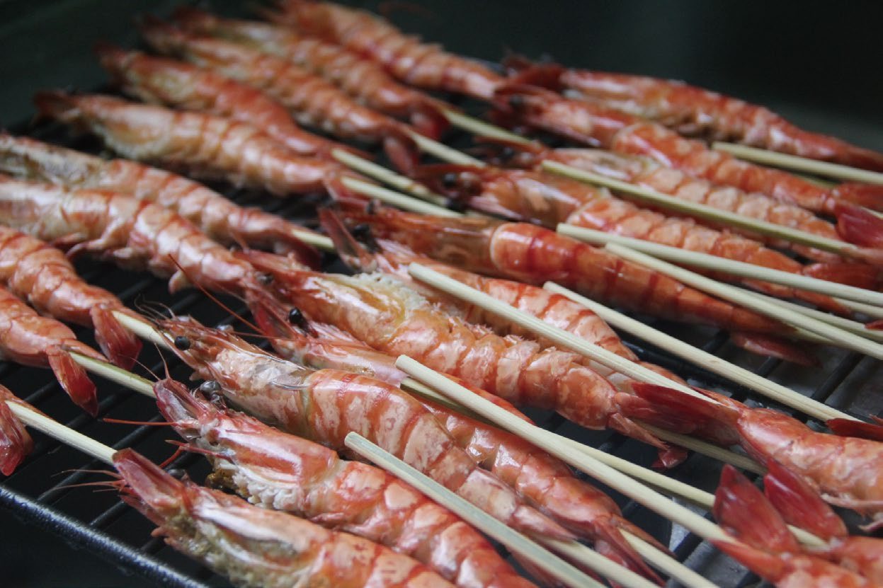 Grilled seafood on a non-stick flat grate
